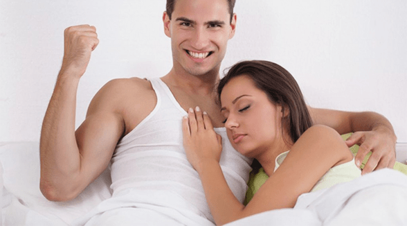 a woman in bed with a man who has increased potential